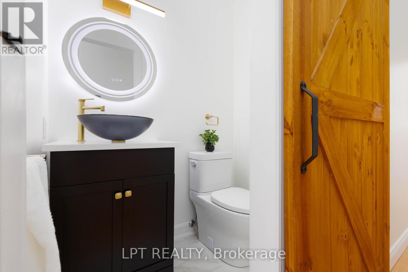 Main Floor Powder Room - 50 Concession Rd 2 W, Tiny, ON - Indoor Photo Showing Bathroom