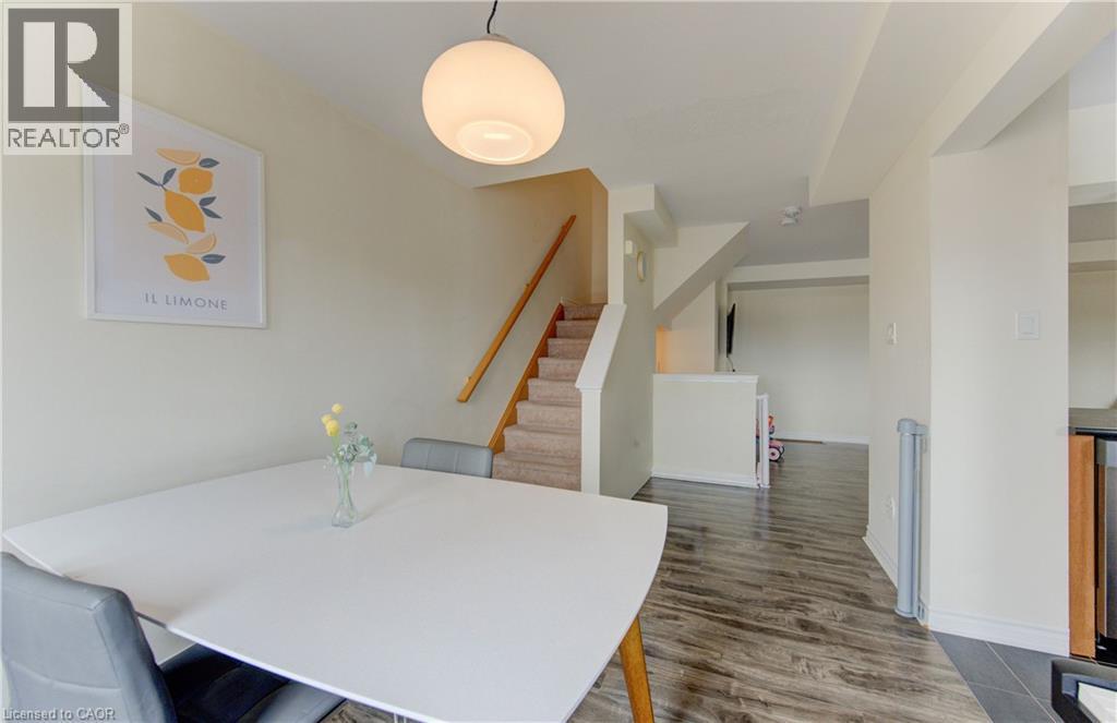 Dining area with dark wood-type flooring and baseboards - 9 Outlook Terrace, Kitchener, ON - Indoor