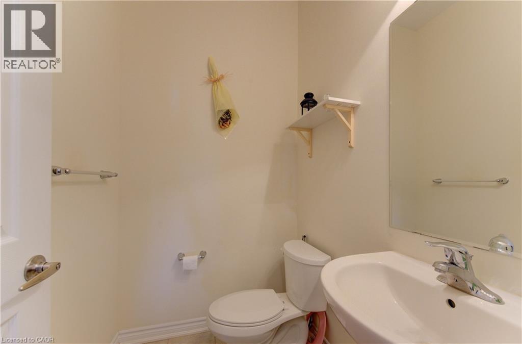 Bathroom featuring toilet and a sink - 9 Outlook Terrace, Kitchener, ON - Indoor Photo Showing Bathroom