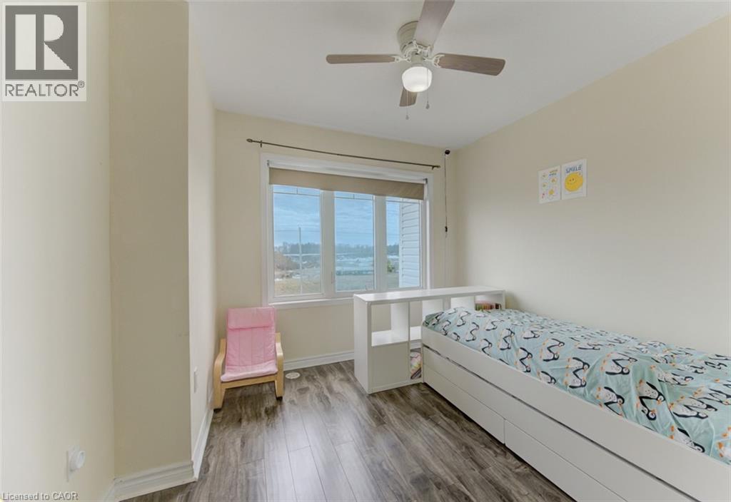 Bedroom with dark wood-type flooring and ceiling fan - 9 Outlook Terrace, Kitchener, ON - Indoor Photo Showing Bedroom