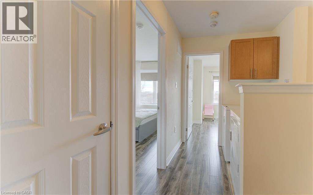 Corridor featuring dark wood-style flooring and baseboards - 9 Outlook Terrace, Kitchener, ON - Indoor Photo Showing Other Room