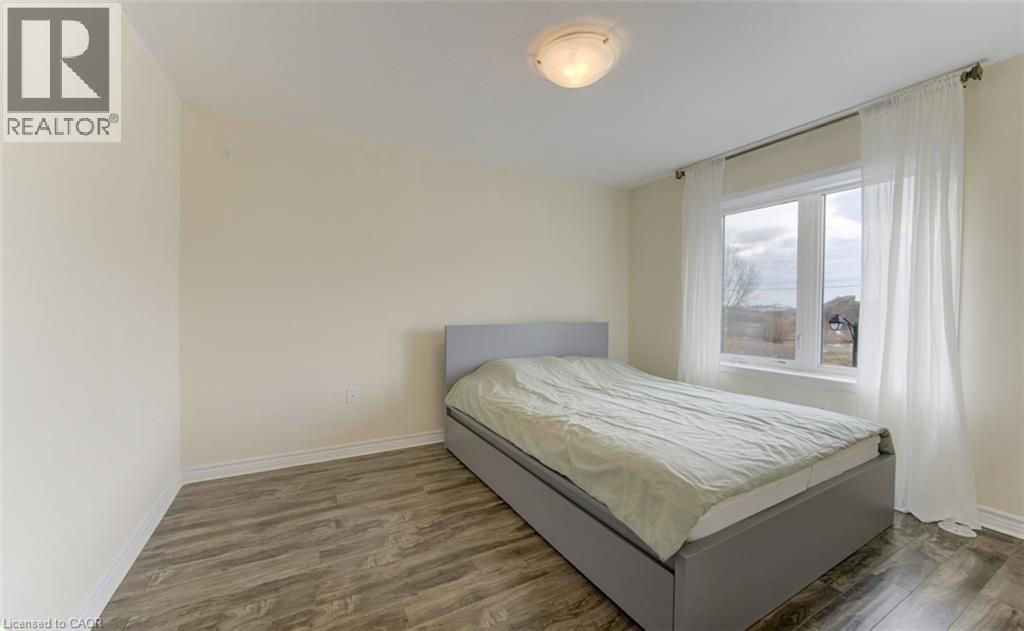 Bedroom featuring dark wood-style floors - 9 Outlook Terrace, Kitchener, ON - Indoor Photo Showing Bedroom