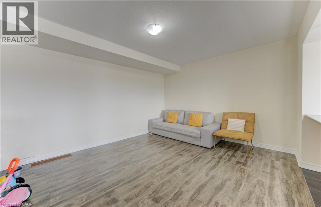 Sitting room featuring light wood-type flooring and baseboards - 9 Outlook Terrace, Kitchener, ON - Indoor