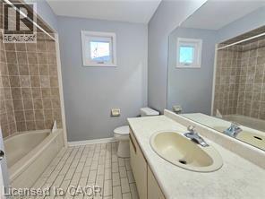 Bathroom featuring vanity and shower / washtub combination - 486 Dicenzo Drive, Hamilton, ON - Indoor Photo Showing Bathroom