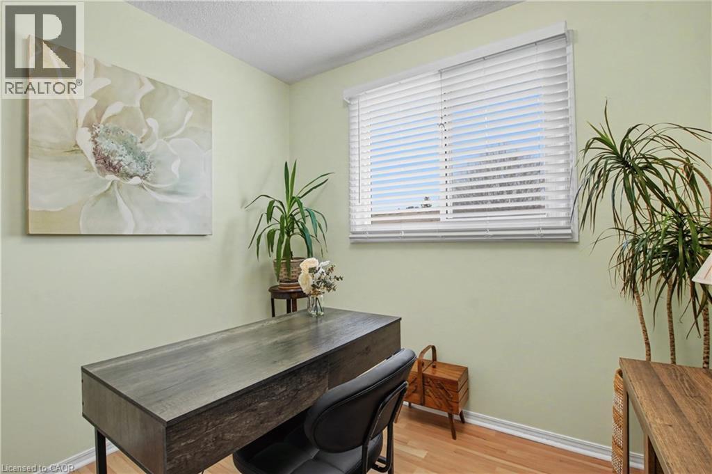 Office area featuring light wood-type flooring and a textured ceiling - 21 Greystone Crescent, St. Catharines, ON - Indoor