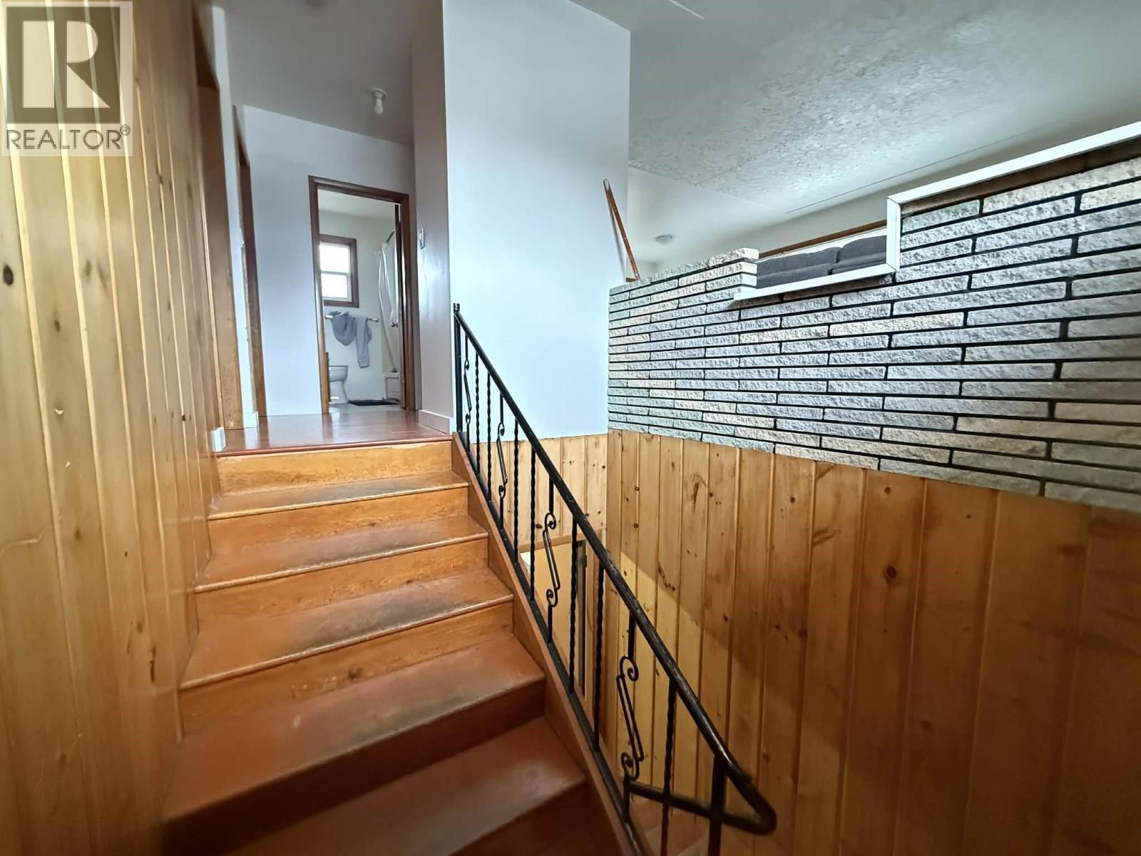 Stairs leading to two bedroom suite. - 1503 3A Highway, Castlegar, BC