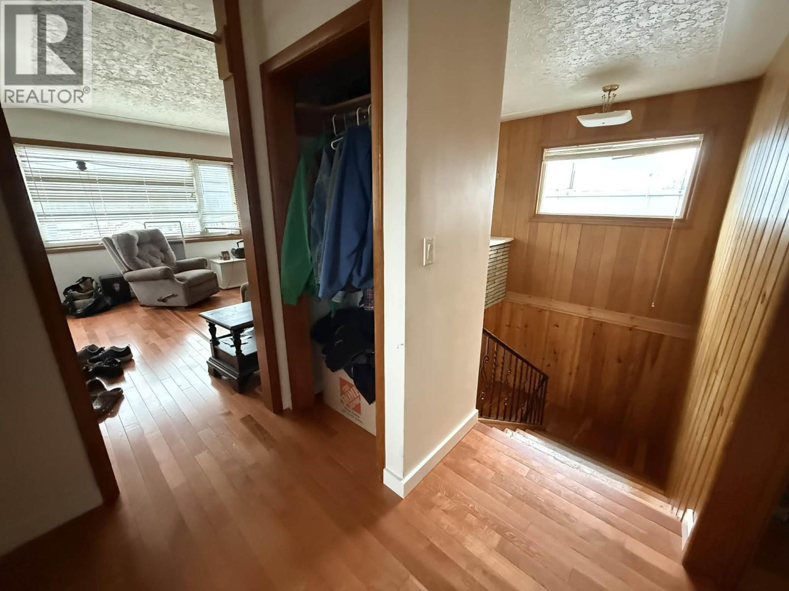 Top of stairs that lead to the living room in the two bedroom suite. - 1503 3A Highway, Castlegar, BC