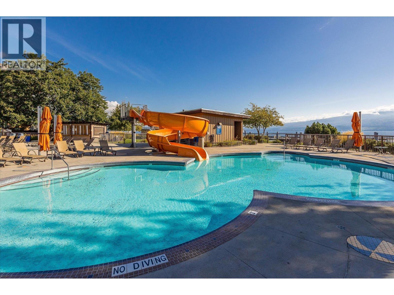 4205 Gellatly Road Unit# 305, West Kelowna, BC - Outdoor With In Ground Pool With Backyard