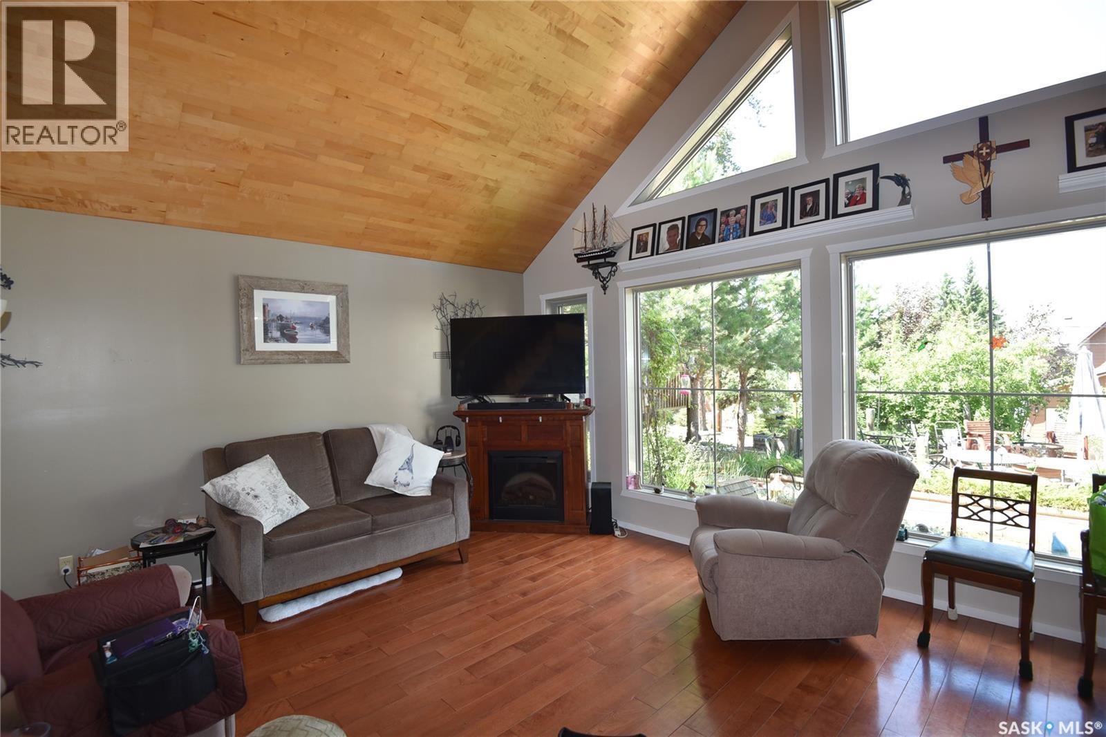 621 Pine Drive, Tobin Lake, SK - Indoor Photo Showing Living Room With Fireplace