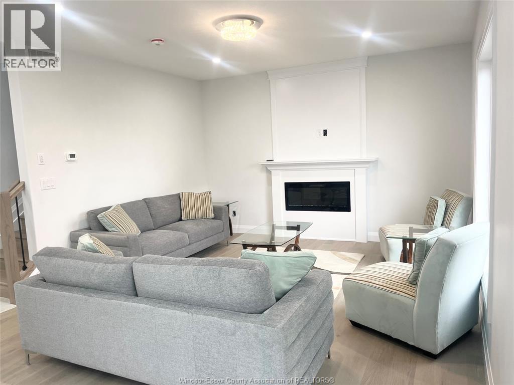 31 Eagle, Leamington, ON - Indoor Photo Showing Living Room With Fireplace