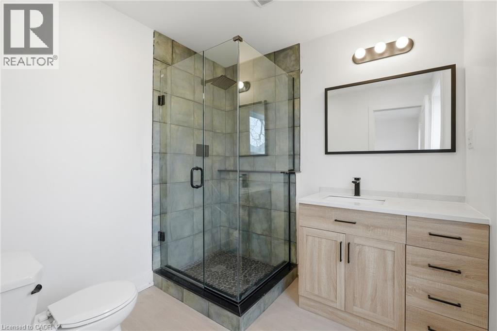 Full bath featuring vanity and a stall shower - 1278 Main Street E, Hamilton, ON - Indoor Photo Showing Bathroom