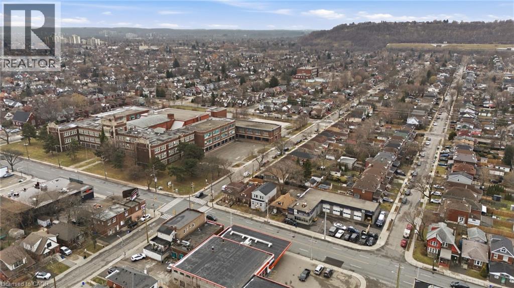 Aerial view of property and surrounding area with property parcel outlined - 1278 Main Street E, Hamilton, ON -