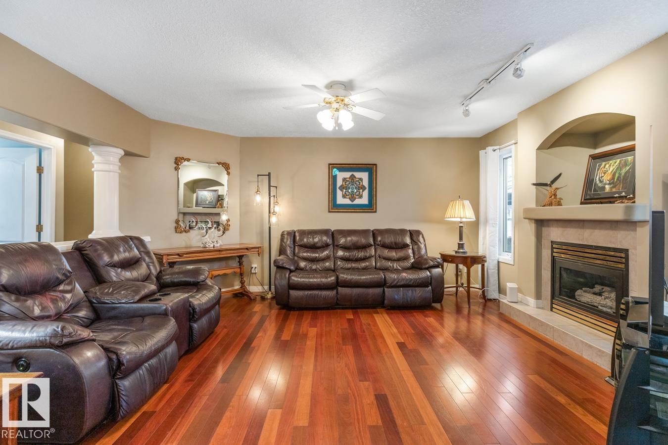 454 Ormsby Rd W Nw, Edmonton, AB - Indoor Photo Showing Living Room With Fireplace