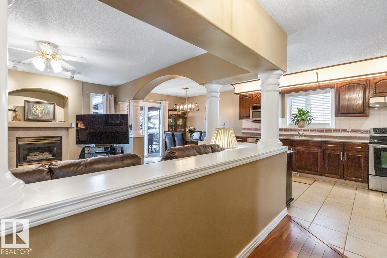 454 Ormsby Rd W Nw, Edmonton, AB - Indoor Photo Showing Kitchen With Fireplace