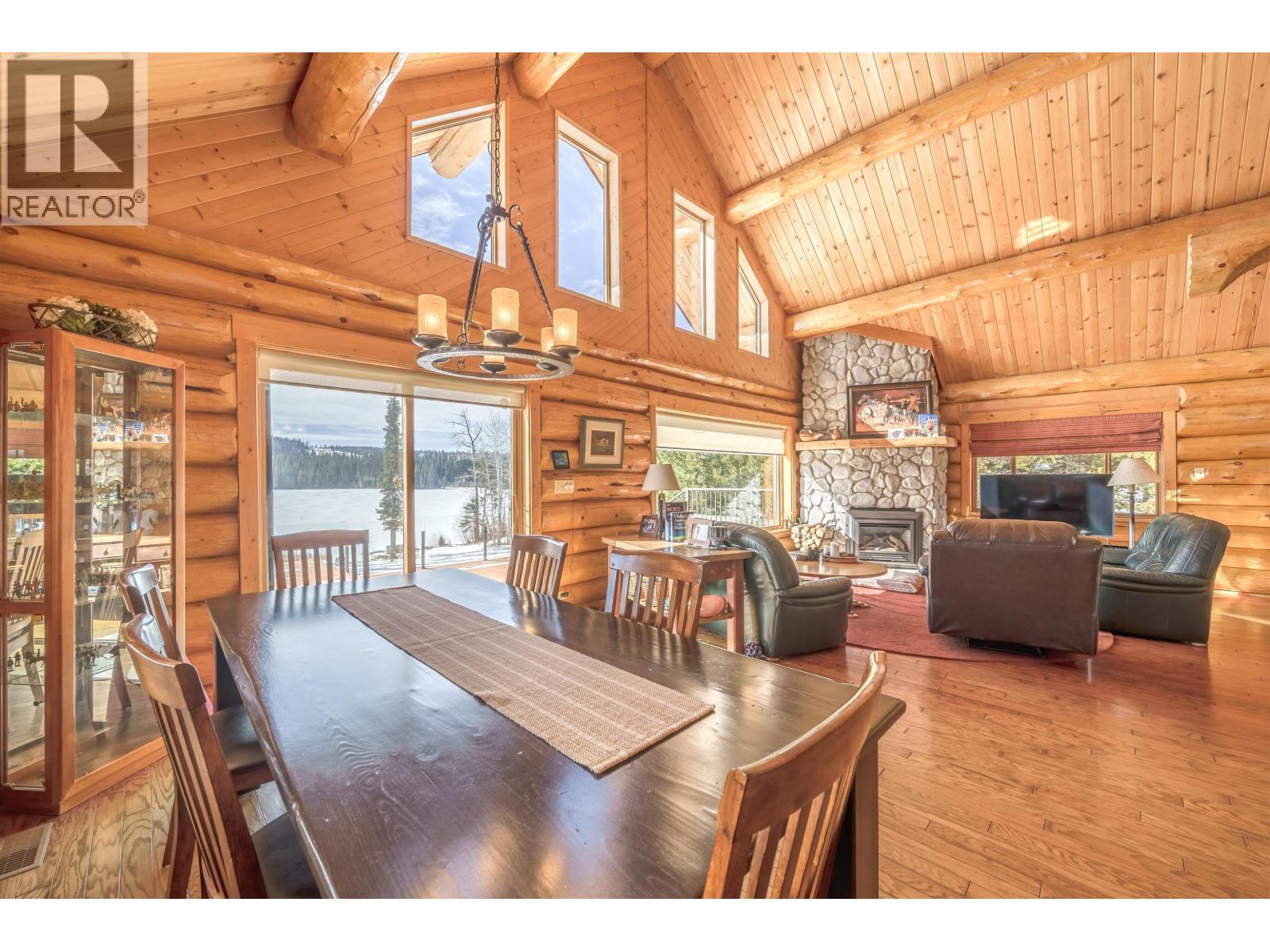 7540 Mccarthy Road, Bridge Lake, BC - Indoor Photo Showing Dining Room With Fireplace