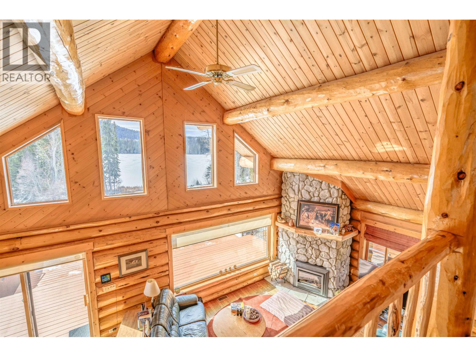 7540 Mccarthy Road, Bridge Lake, BC - Indoor Photo Showing Other Room With Fireplace