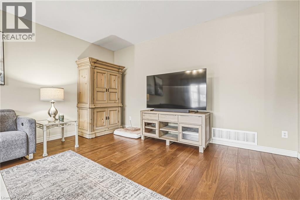 Living area with dark wood-style flooring - 120 Valiant Circle, Hamilton, ON - Indoor Photo Showing Living Room