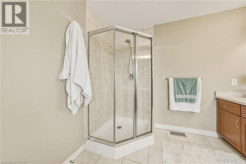 Bathroom with vanity, a stall shower, and light tile patterned flooring - 120 Valiant Circle, Hamilton, ON - Indoor Photo Showing Bathroom