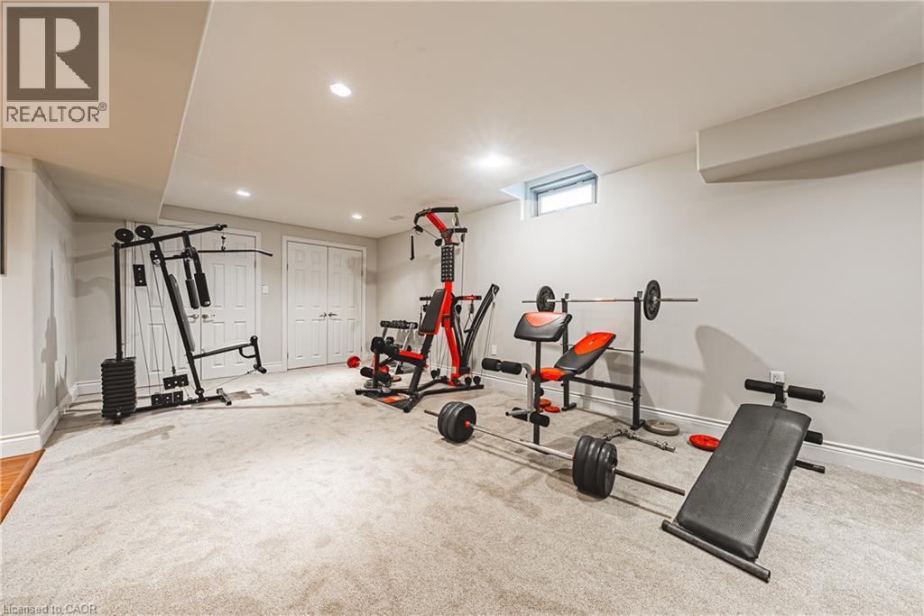 Exercise area with carpet flooring and recessed lighting - 120 Valiant Circle, Hamilton, ON - Indoor Photo Showing Gym Room