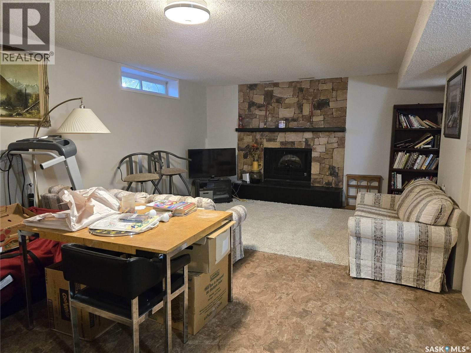 314 Milden Street, Conquest, SK - Indoor Photo Showing Living Room With Fireplace