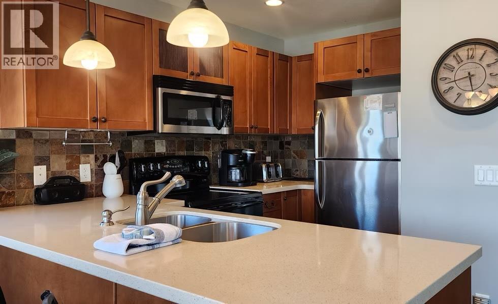 6844 Madrid Way Unit# 321, Fintry, BC - Indoor Photo Showing Kitchen With Double Sink