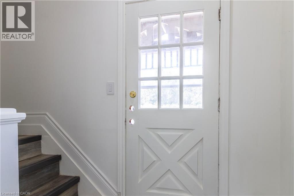 Doorway featuring stairway and a decorative wall - 1411 E 56 Highway, Glanbrook, ON - Indoor Photo Showing Other Room