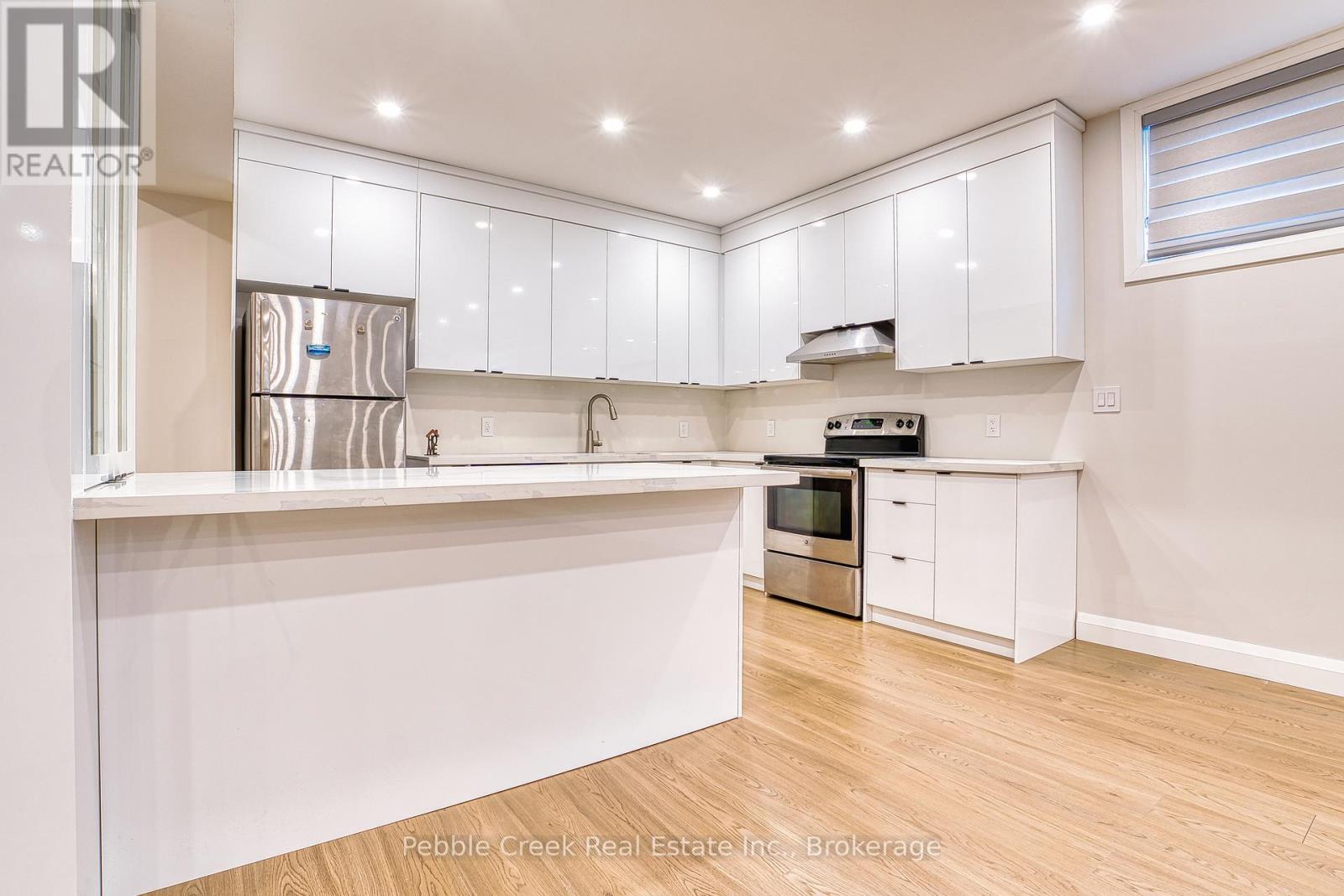 kitchen in basement with lots of storage - 182 Shearwater Trail, Goderich (Goderich (Town)), ON - Indoor Photo Showing Kitchen