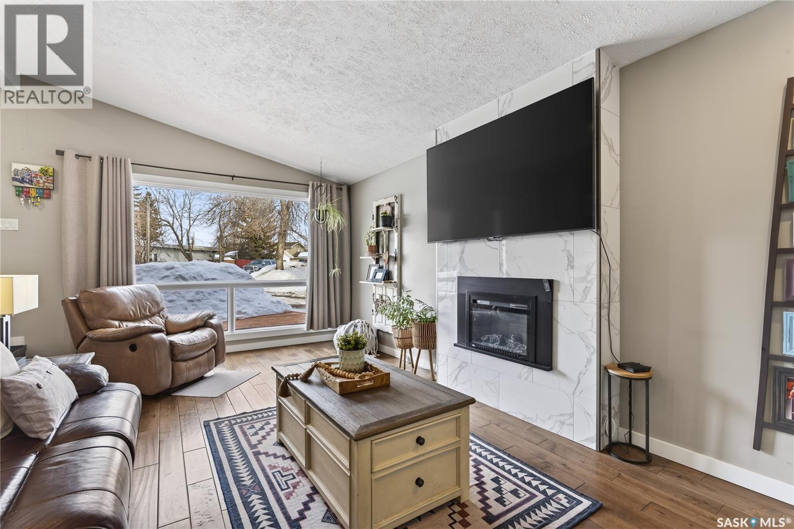 35 King Crescent, Humboldt, SK - Indoor Photo Showing Living Room With Fireplace