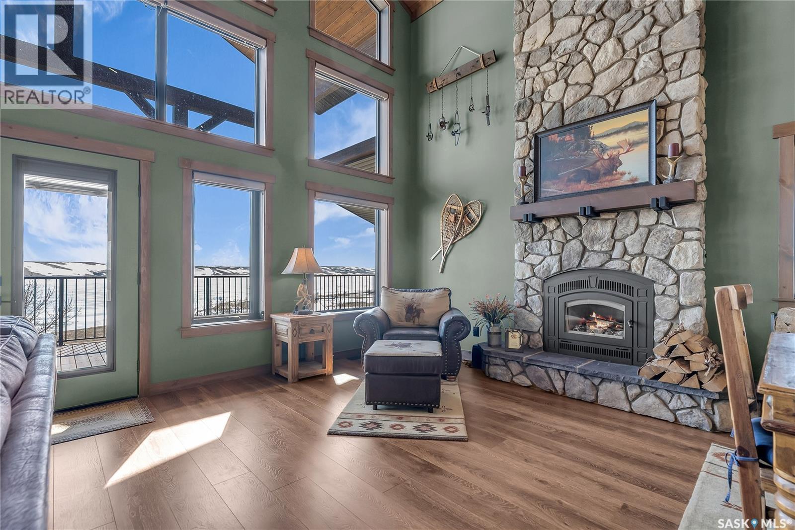 35 Grace Bay, Diefenbaker Lake, SK - Indoor Photo Showing Living Room With Fireplace