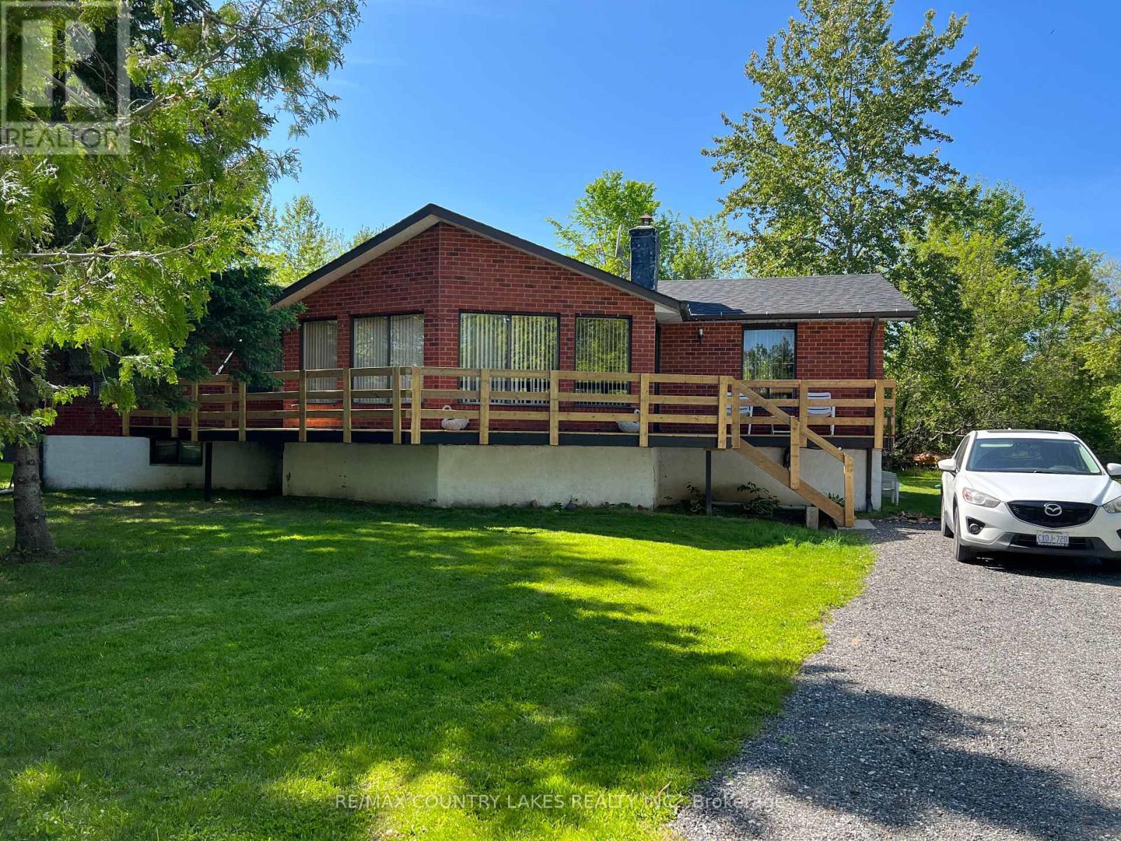 Main View Summer - 4 Macpherson Crescent, Kawartha Lakes, ON - Outdoor With Deck Patio Veranda