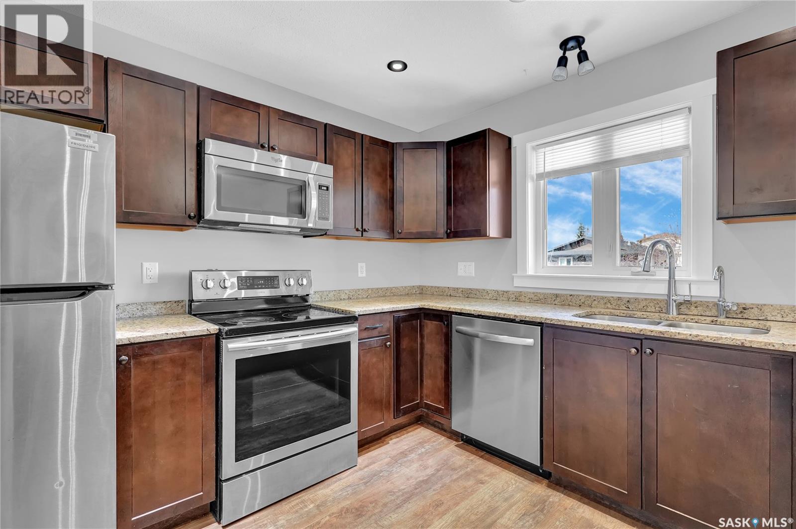3347 Coughlin Bay E, Regina, SK - Indoor Photo Showing Kitchen With Stainless Steel Kitchen With Double Sink