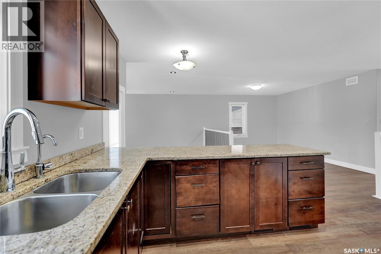 3347 Coughlin Bay E, Regina, SK - Indoor Photo Showing Kitchen With Double Sink