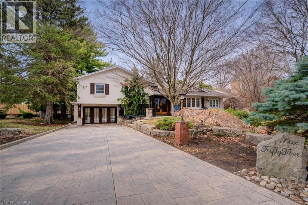 View of front of property with french doors, driveway, and stucco siding - 655 Ellengale Road, Burlington, ON - Outdoor