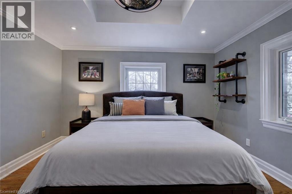 Bedroom with dark wood-style floors, crown molding, and recessed lighting - 655 Ellengale Road, Burlington, ON - Indoor Photo Showing Bedroom