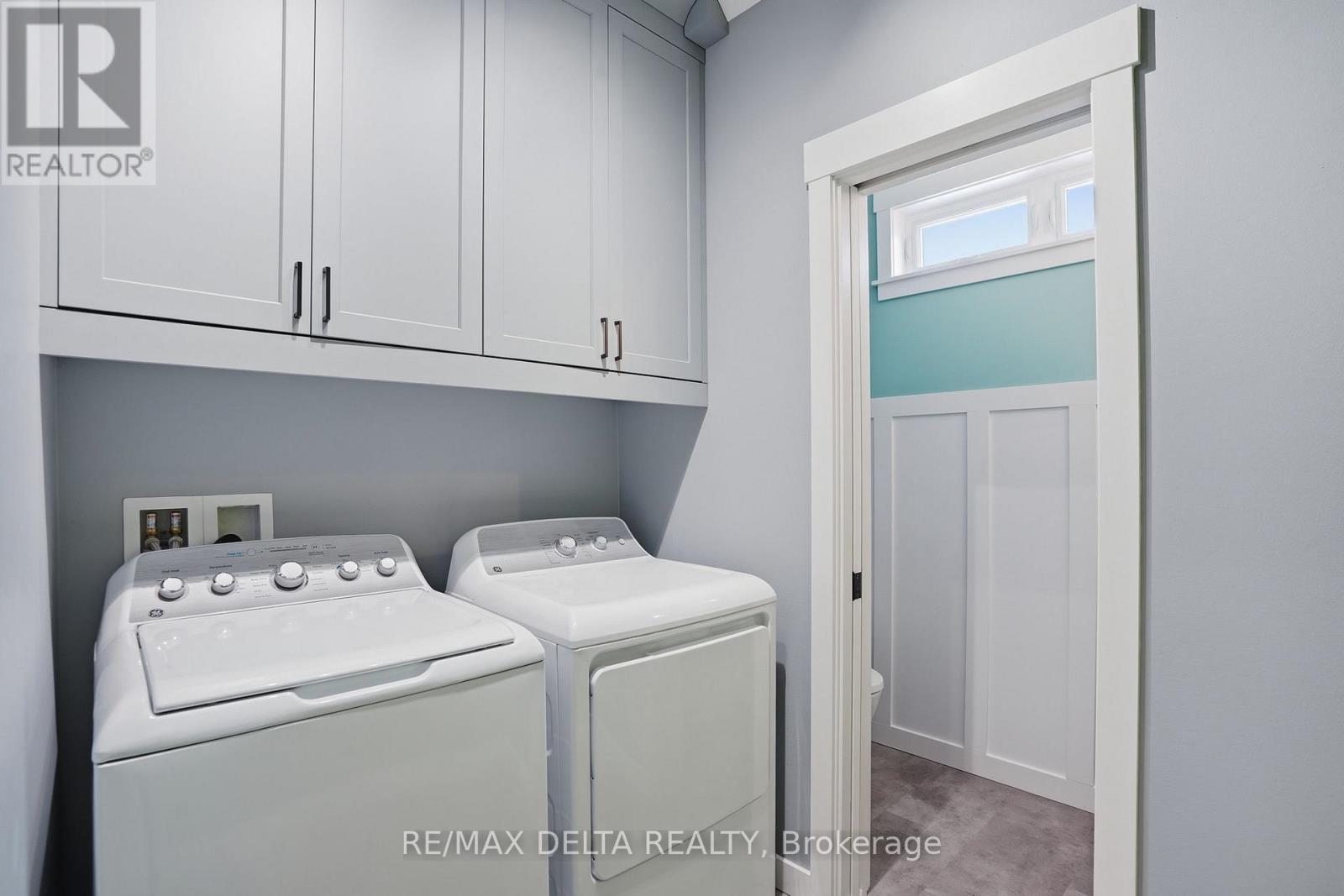Laundry area, powder room to left. - 100 Pendleton Street, Champlain, ON - Indoor Photo Showing Laundry Room