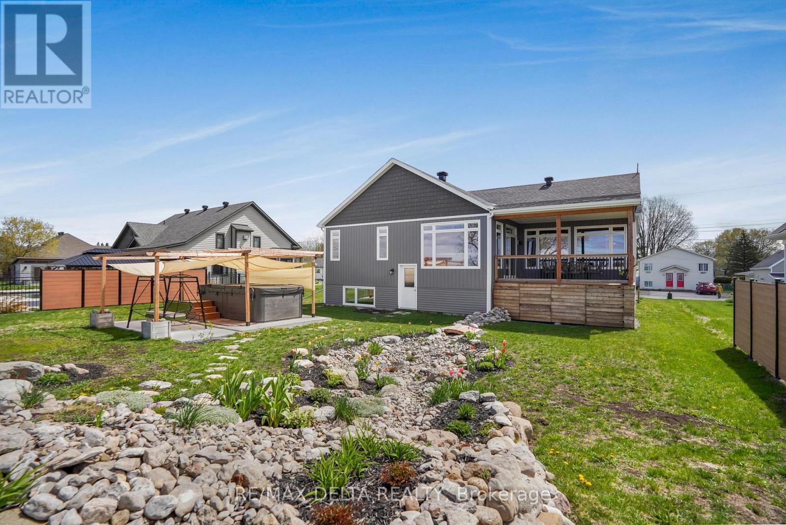 A dry river landscaping feature. - 100 Pendleton Street, Champlain, ON - Outdoor With Deck Patio Veranda