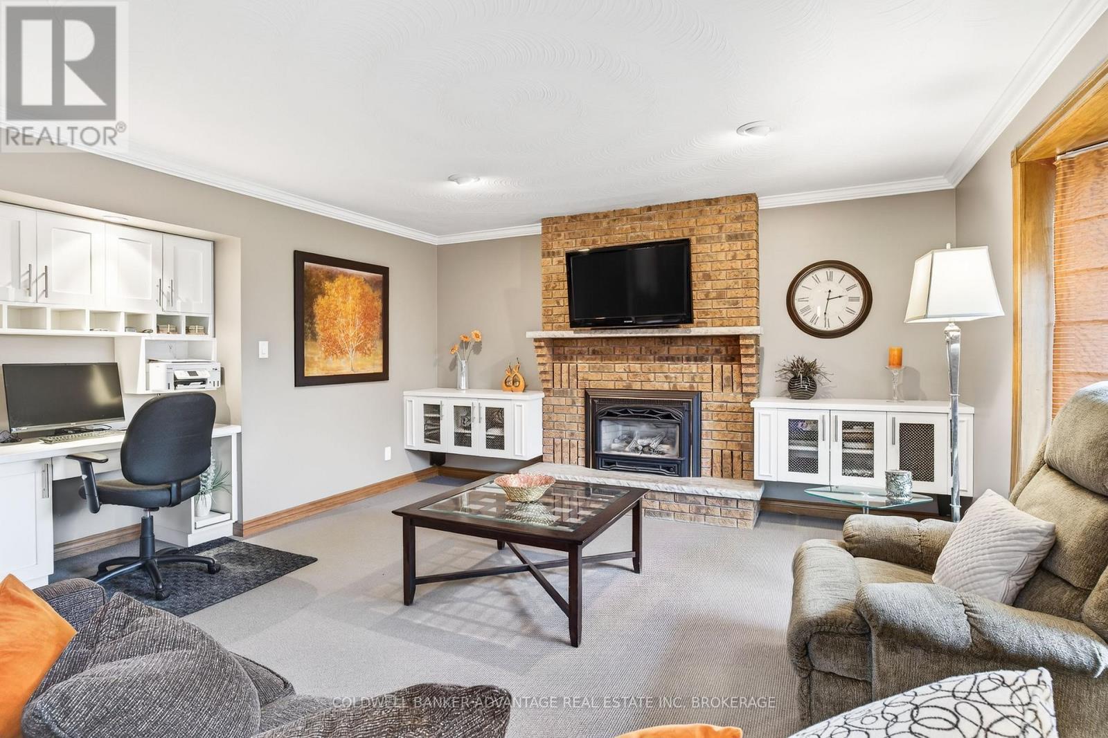 Family room next to kitchen - 41 Adel Drive E, St. Catharines (Carlton/Bunting), ON - Indoor Photo Showing Living Room With Fireplace