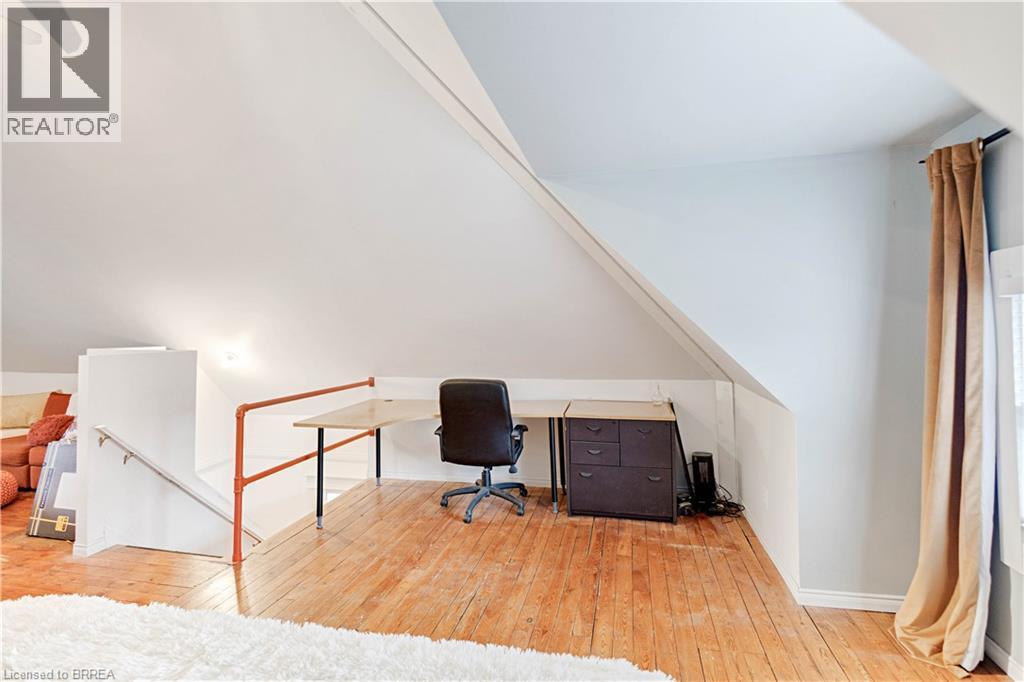 Office with light wood finished floors and lofted ceiling - 134 Sherman Avenue S, Hamilton, ON - Indoor Photo Showing Other Room