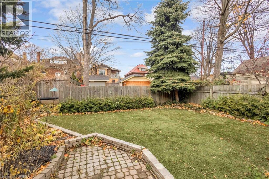 View of fenced backyard - 134 Sherman Avenue S, Hamilton, ON - Outdoor