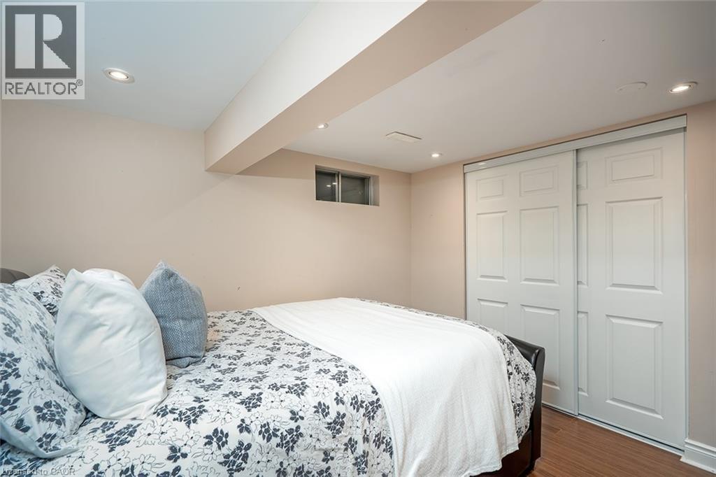 Bedroom featuring recessed lighting, dark wood finished floors, and a closet - 1278 Consort Crescent, Burlington, ON - Indoor Photo Showing Bedroom