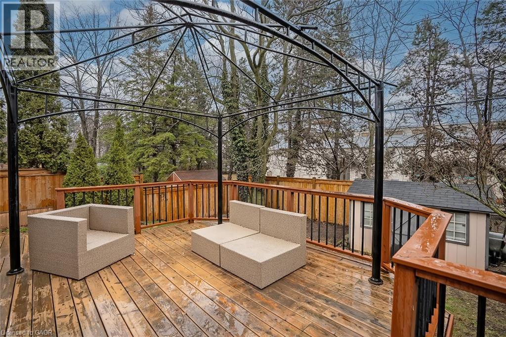 Wooden deck with outdoor furniture and a storage unit - 1278 Consort Crescent, Burlington, ON - Outdoor With Deck Patio Veranda With Exterior