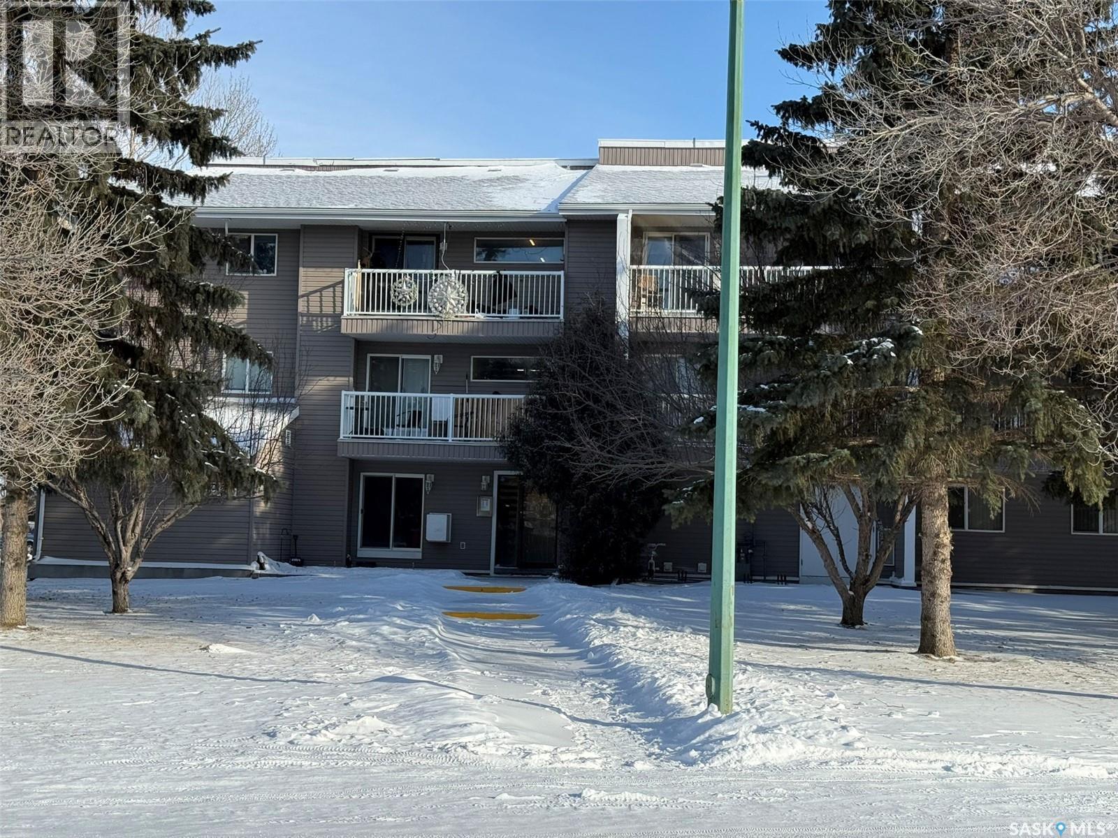 207 1808 Eaglesham Avenue, Weyburn, SK - Outdoor With Balcony With Facade
