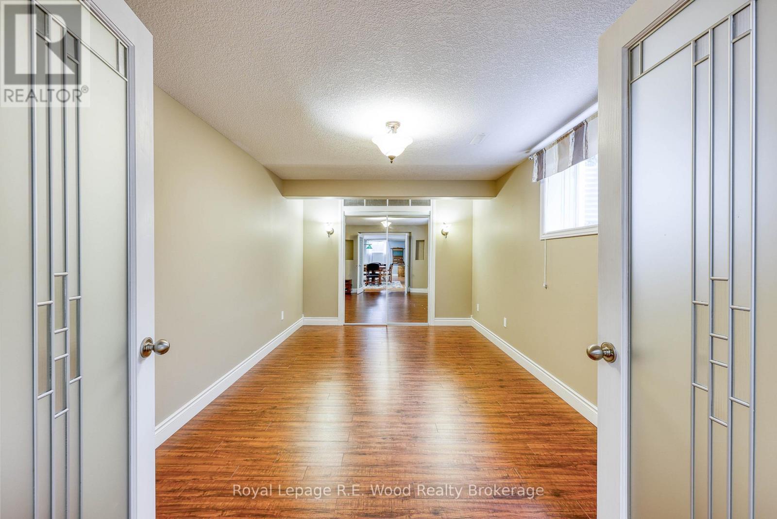 Basement bedroom with double doors - 36 Morning Glory Drive, Tillsonburg, ON - Indoor Photo Showing Other Room