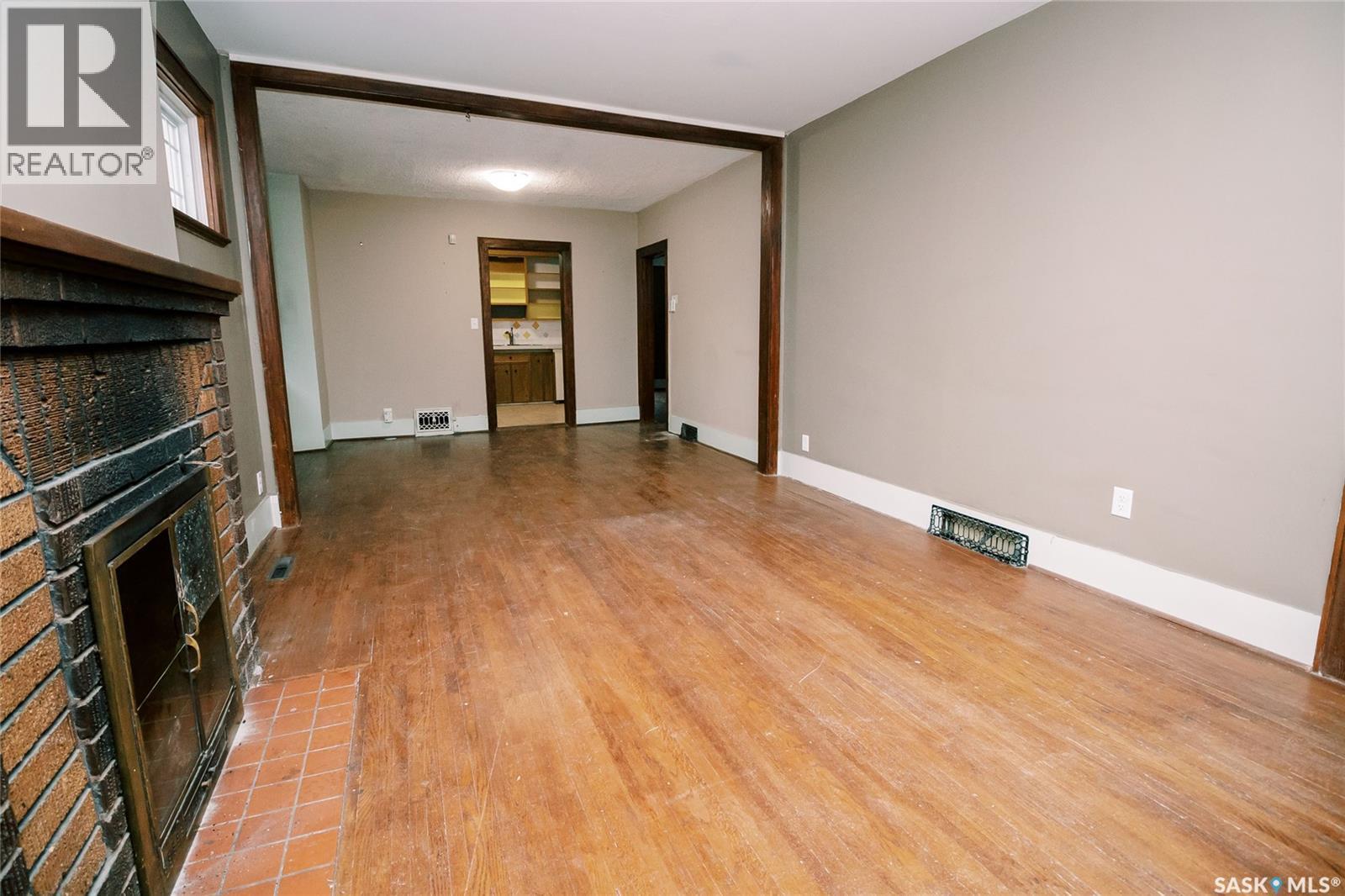 105 28Th Street, Saskatoon, SK - Indoor Photo Showing Other Room With Fireplace