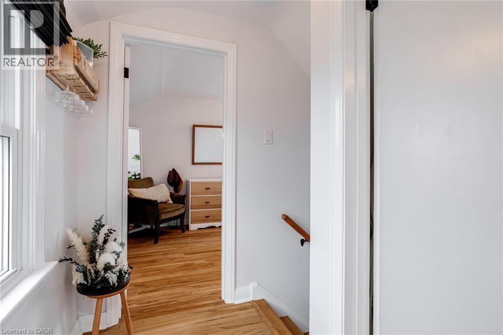 Corridor with an upstairs landing, lofted ceiling, and light wood finished floors - 624 Burgess Avenue, Hamilton, ON - Indoor Photo Showing Other Room