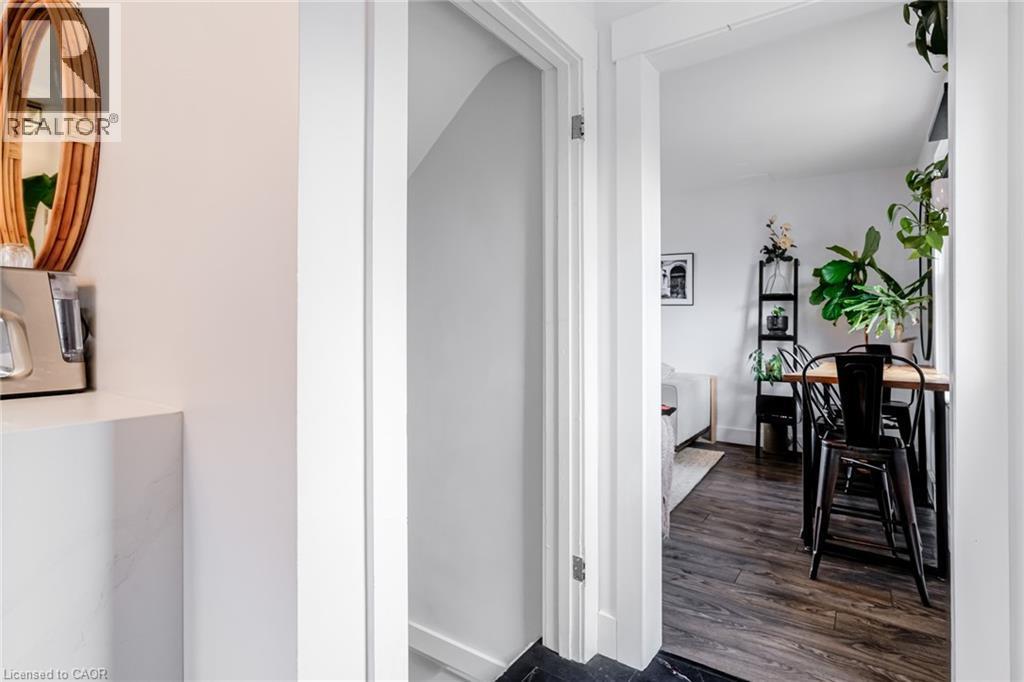 Hall with dark wood finished floors and baseboards - 624 Burgess Avenue, Hamilton, ON - Indoor