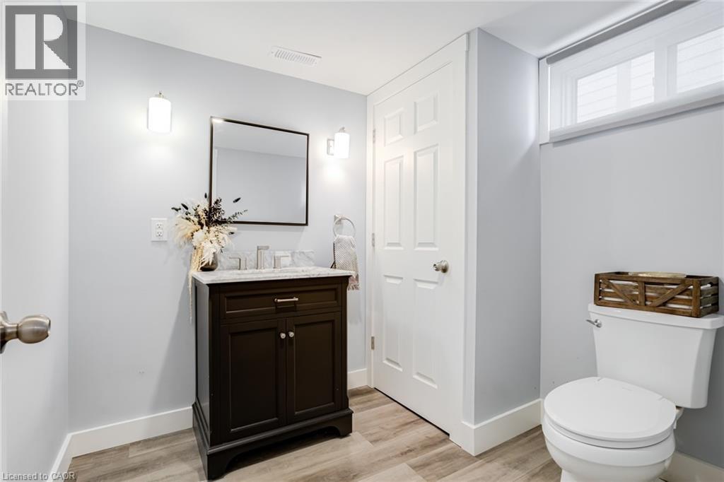 Bathroom with vanity and light wood-style flooring - 624 Burgess Avenue, Hamilton, ON - Indoor Photo Showing Bathroom