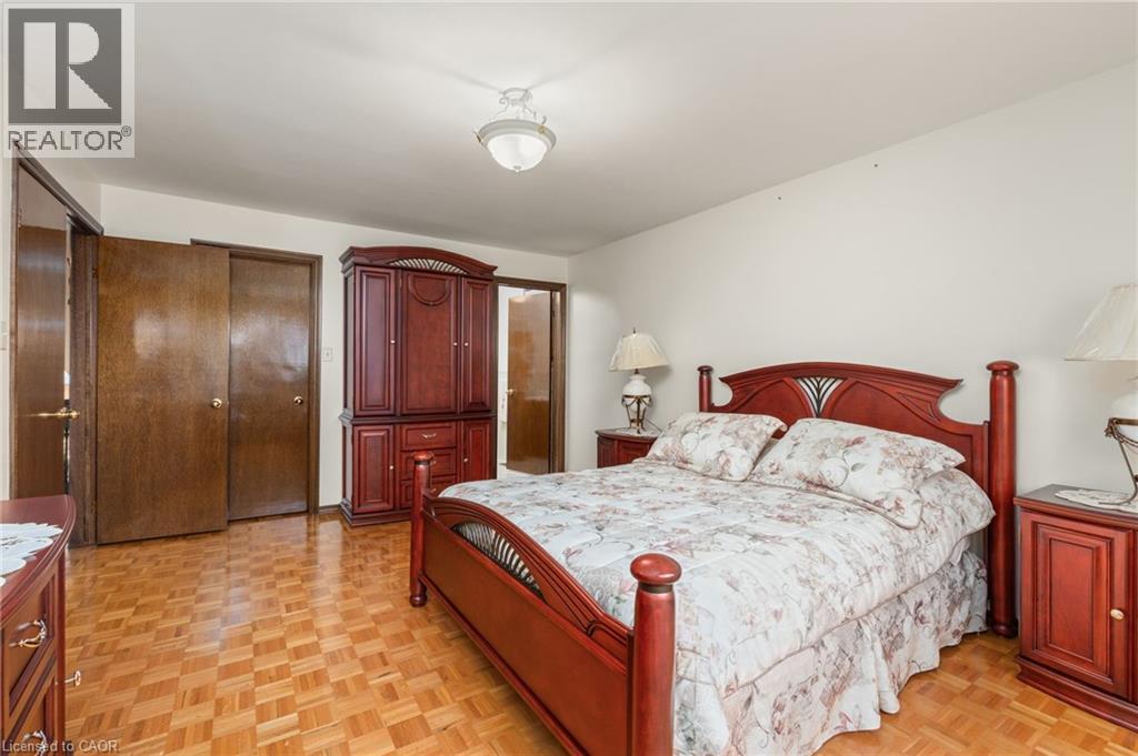 Bedroom featuring a closet, parquet floors, and ensuite bath - 57 Derek Drive, Hamilton, ON - Indoor Photo Showing Bedroom