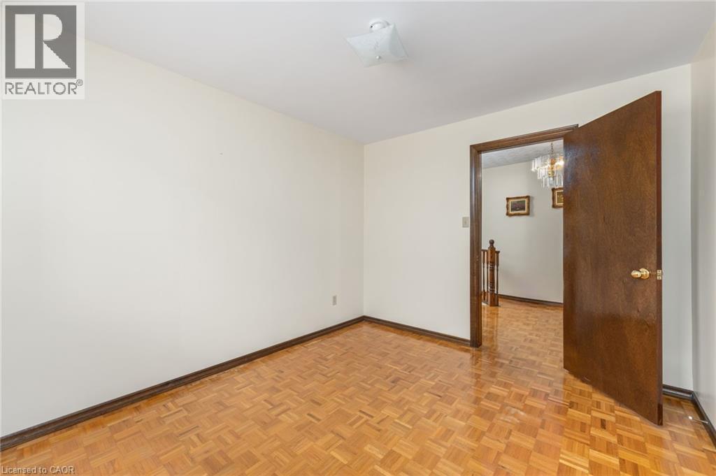Spare room with parquet flooring and baseboards - 57 Derek Drive, Hamilton, ON - Indoor Photo Showing Other Room