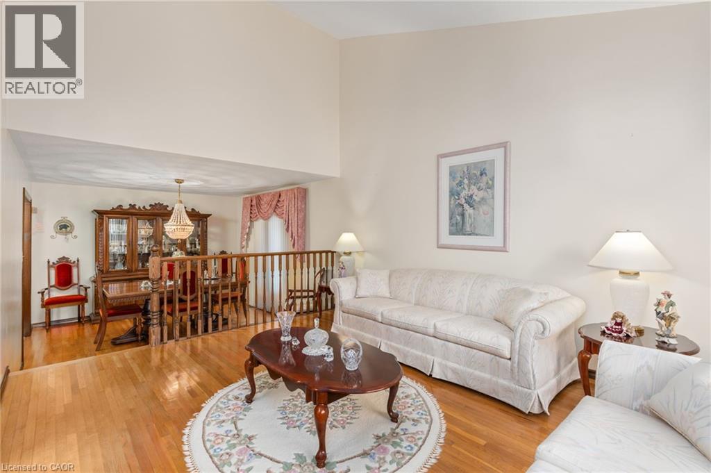 Living area with light wood-style floors and vaulted ceiling - 57 Derek Drive, Hamilton, ON - Indoor Photo Showing Living Room